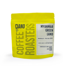 Bolsa de café Myanmar Green Land de color amarillo, destacando su perfil exótico y cuerpo sedoso característico de los microlotes nicaragüenses